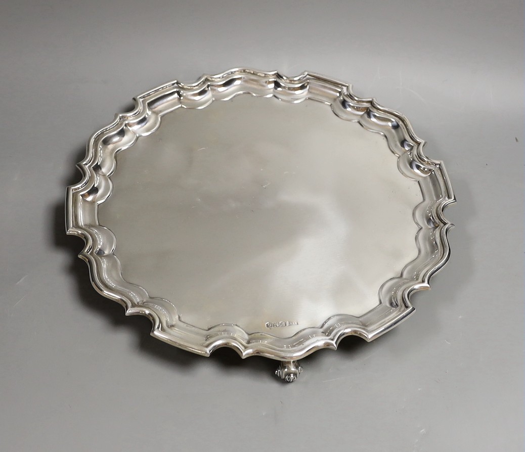 A George VI silver salver, on scroll feet, Walker & Hall, Sheffield, 1949, 31.2cm, 27.2oz.